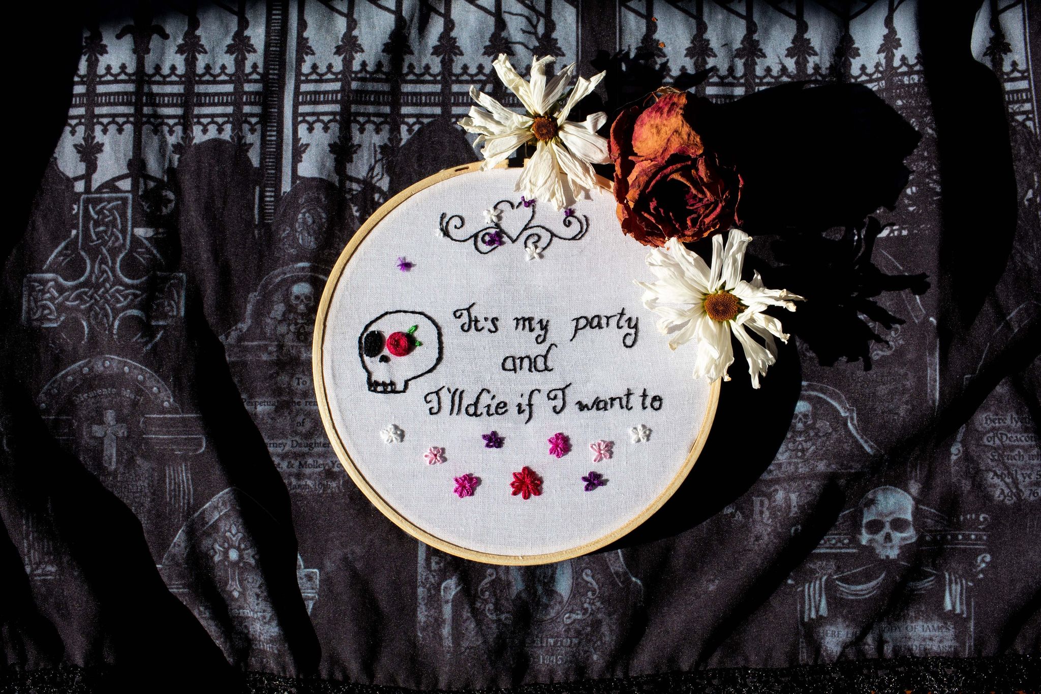 Product image of "It's MY Party" embroidery on  a cemetery backdrop framed with dead flowers